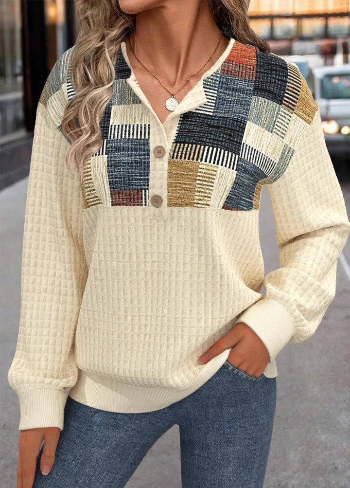 Patchwork trui met knopen