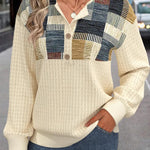 Patchwork trui met knopen