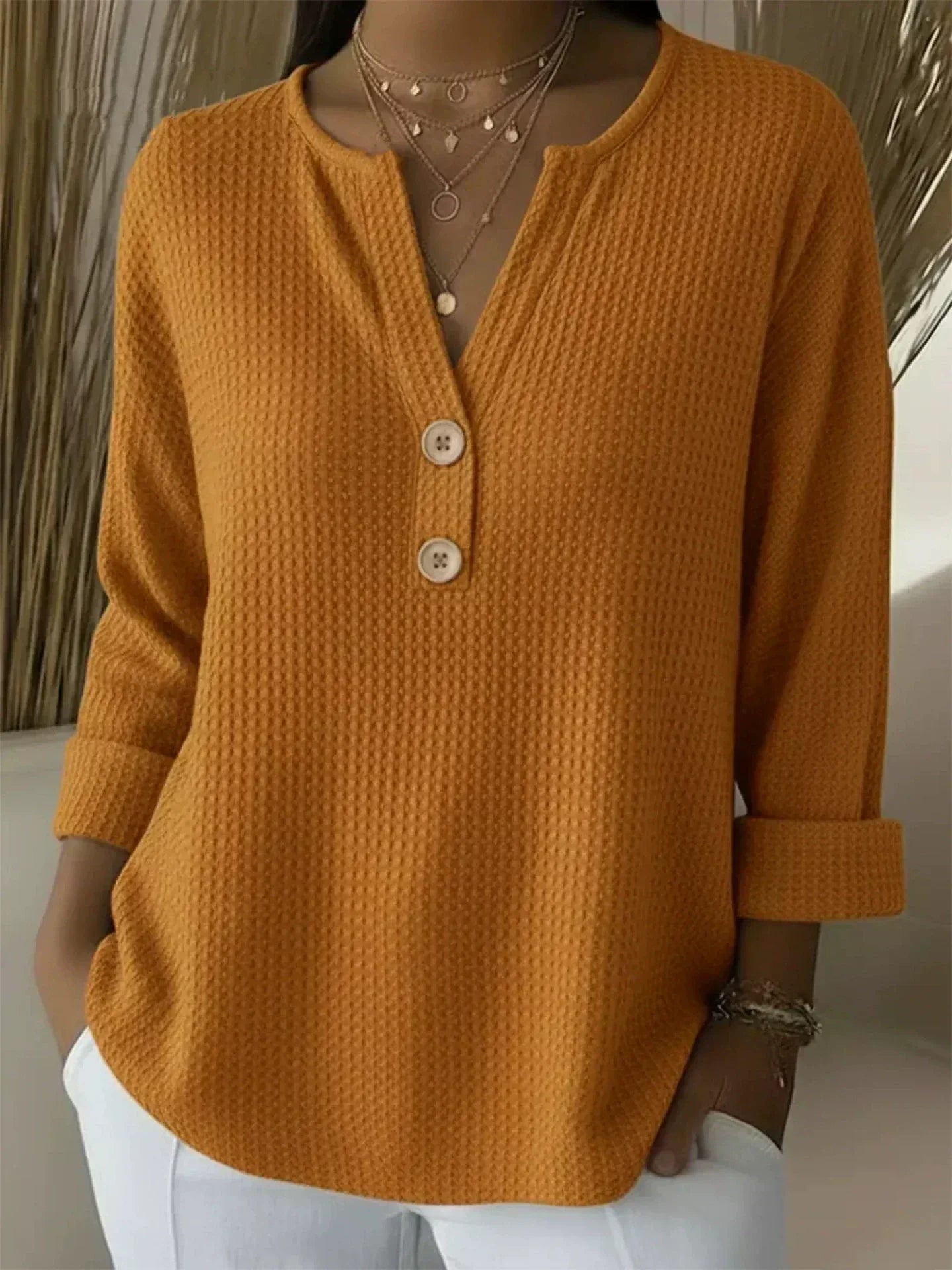 Wafeltrui met henley-detail oranje